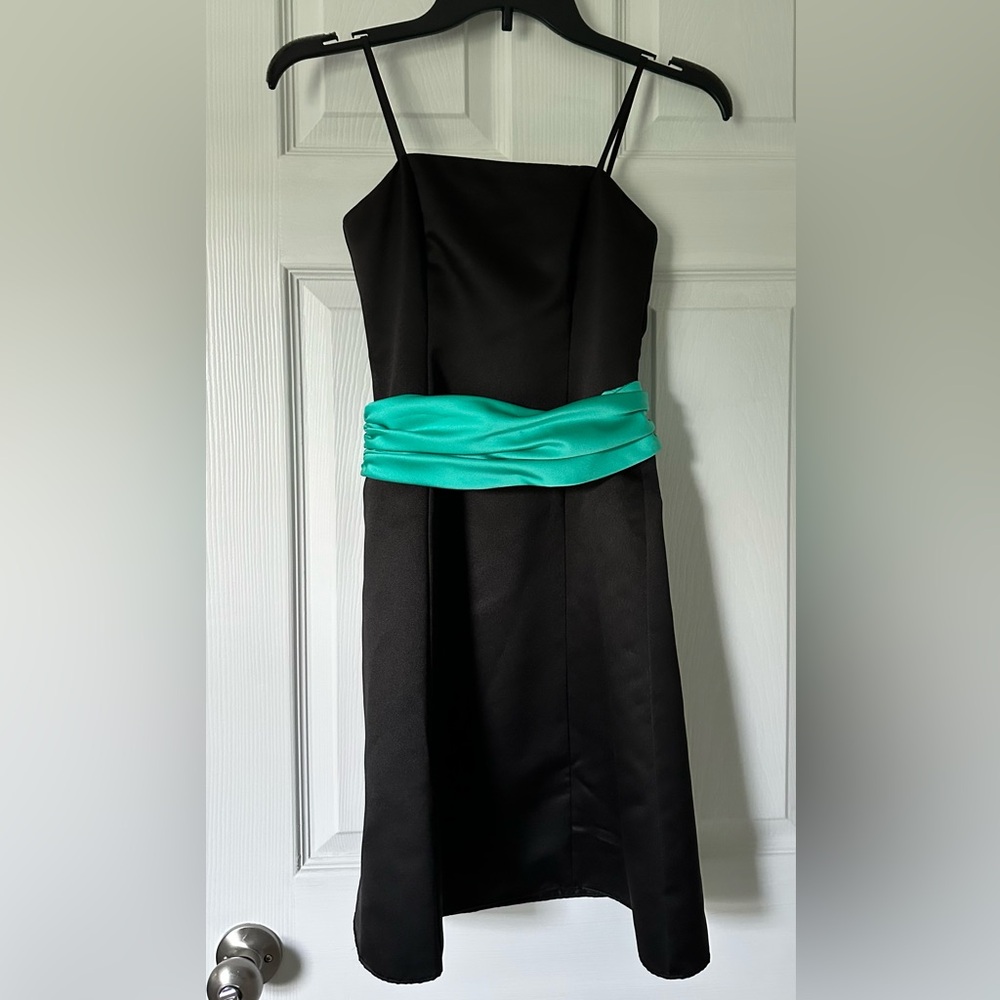 Elegant Black Dress with Teal Accent